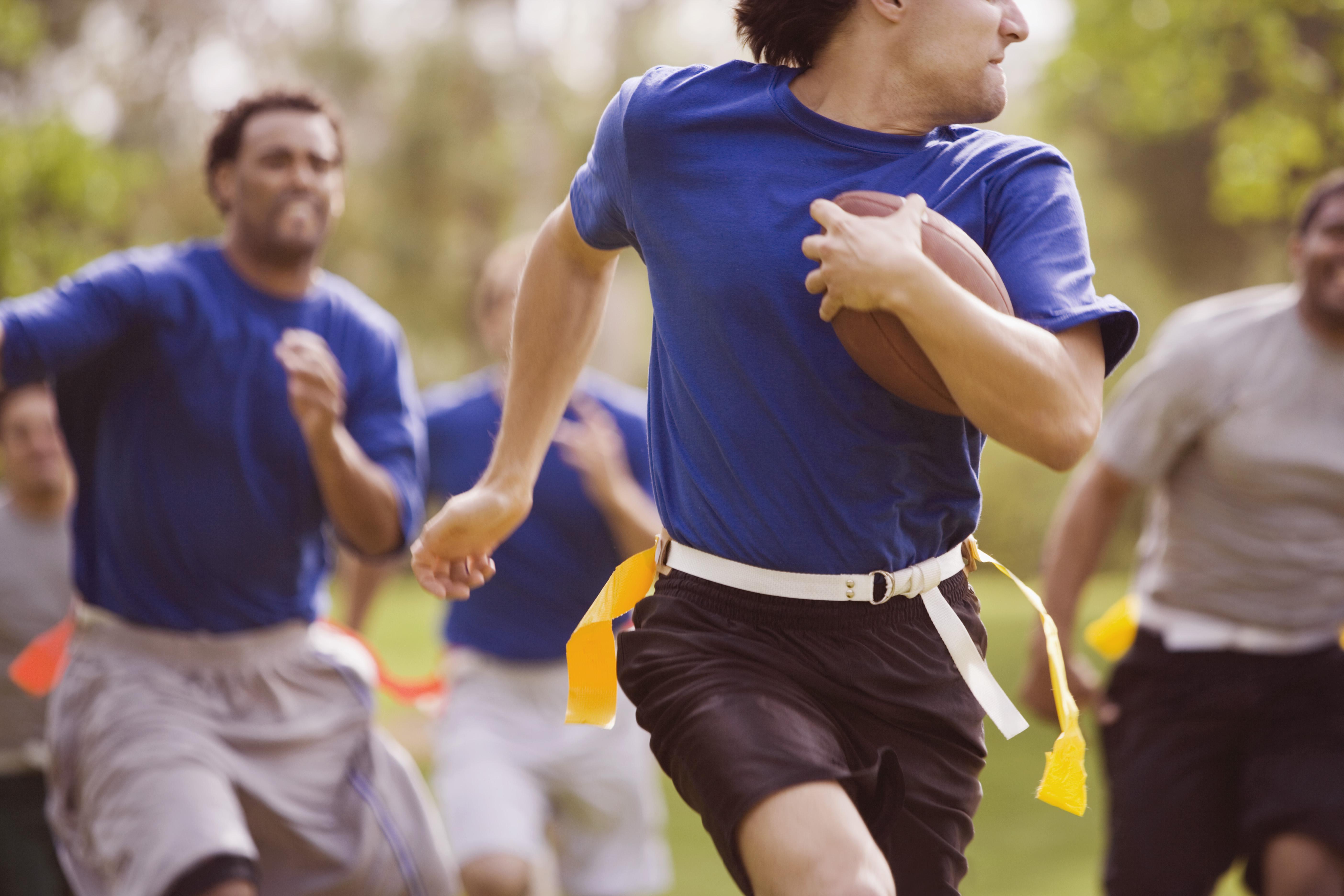 Men playing flag football