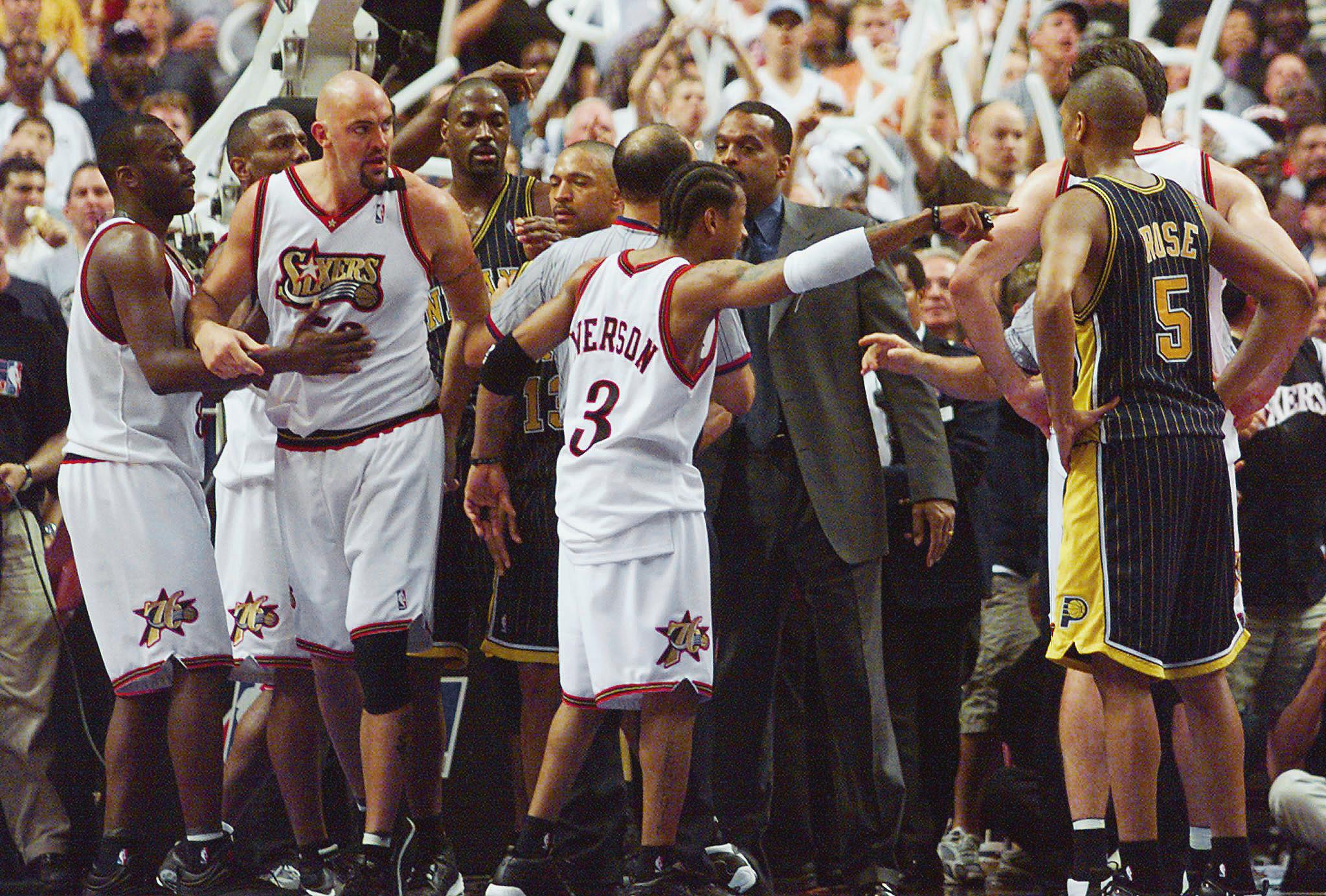 Matt Geiger of the Philadelphia 76ers (2nd-L) is r